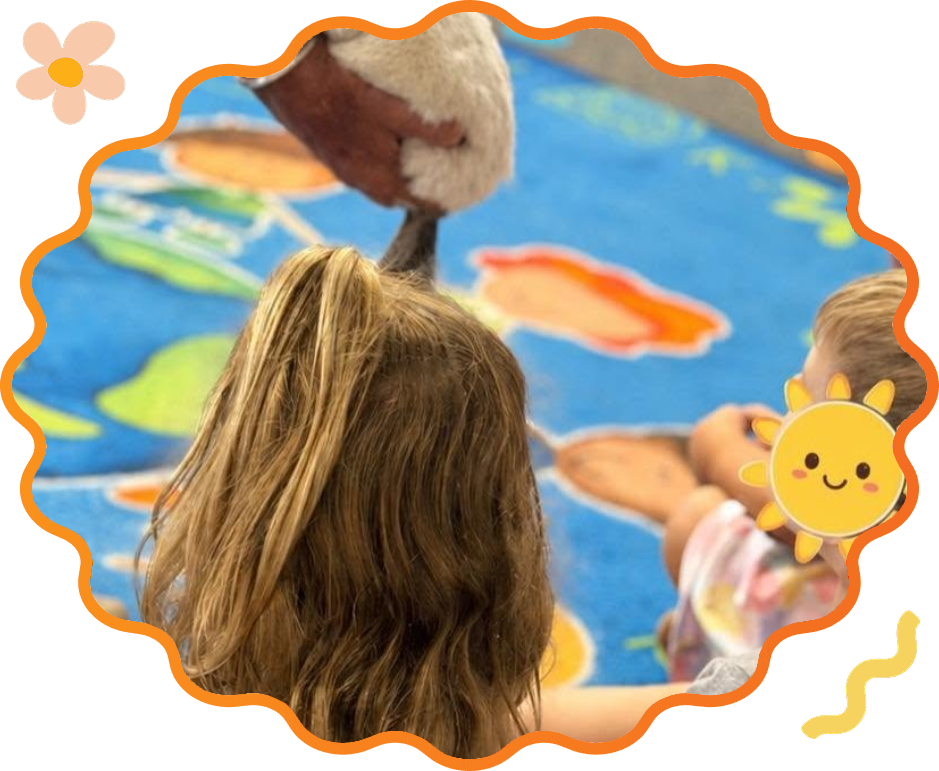 Preschoolers meeting an animal visitor at Sunny Pointe