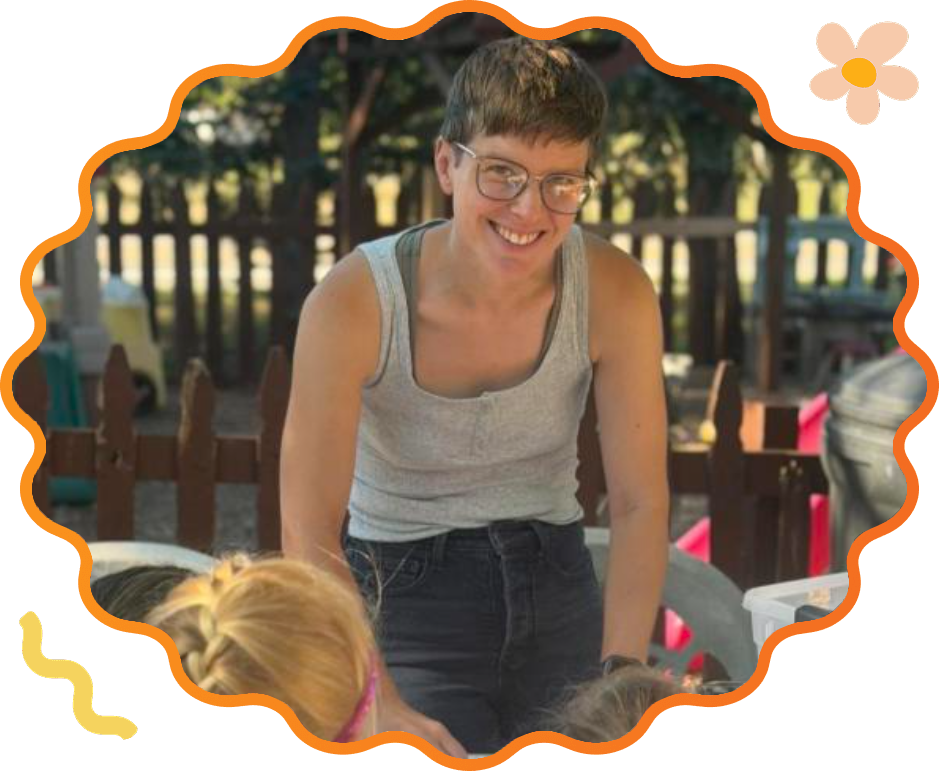 Sunny Pointe teacher leading an outdoor craft activity with preschoolers