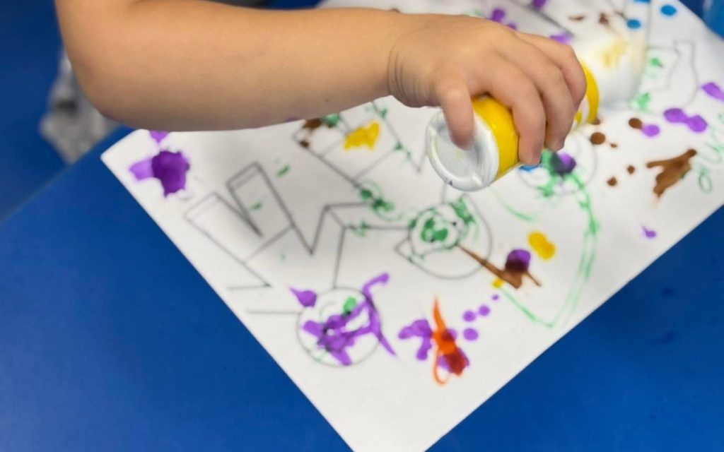 Toddler dot-art painting at Sunny Pointe