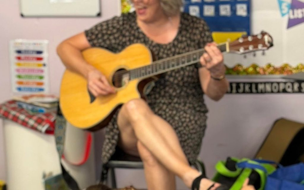 Music time with guitar in a Sunny Pointe classroom