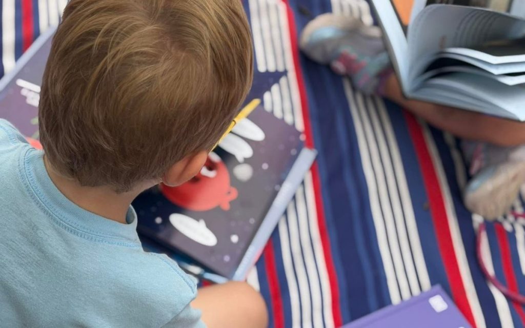Reading time on the blanket at Sunny Pointe