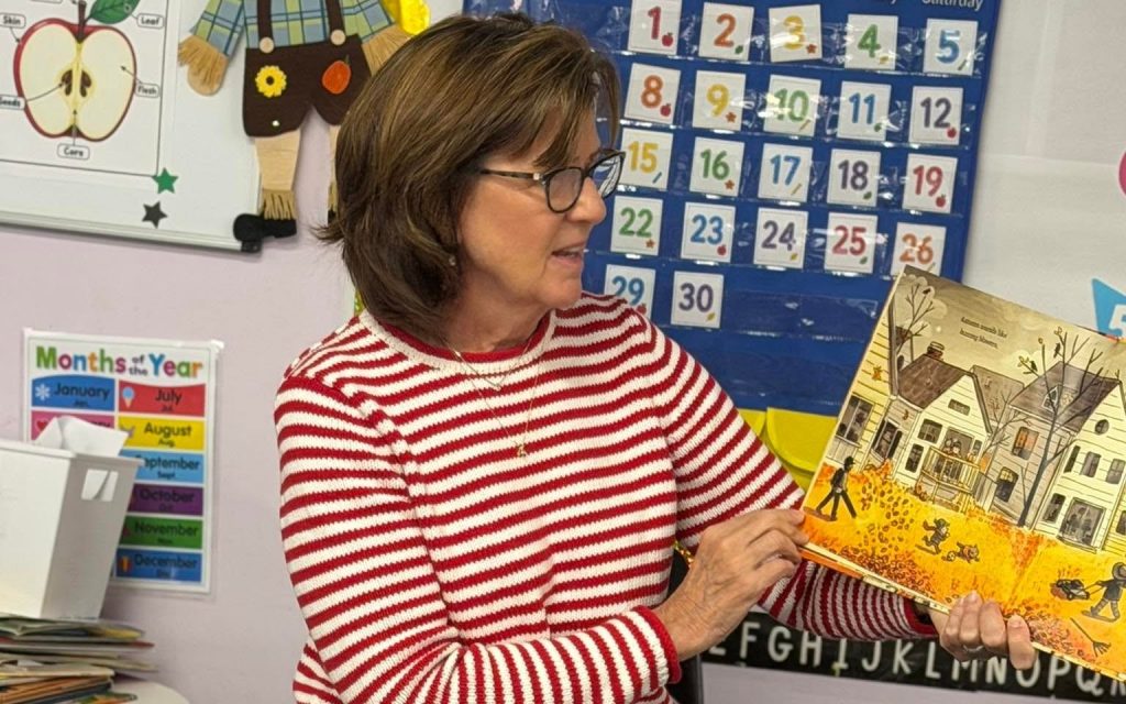 Teacher reading a fall story to preschoolers at Sunny Pointe Childcare Center