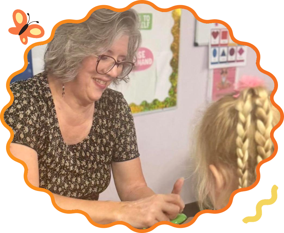 Sunny Pointe teacher working one-on-one with a preschooler in the classroom